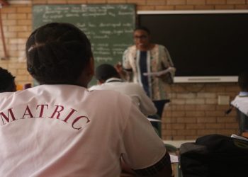 File | A learner wearing a white t- shirt written ''Matric'' is seated in a classroom.