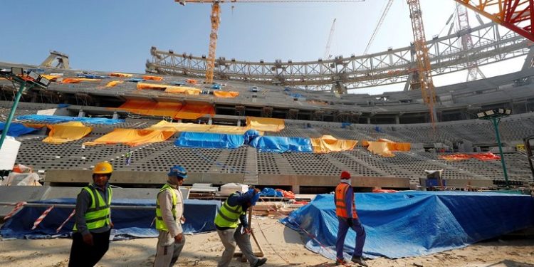 File Photo: Workers are seen inside the Lusail stadium which is under construction for the upcoming 2022 Fifa soccer World Cup during a stadium tour in Doha, Qatar, December 20, 2019