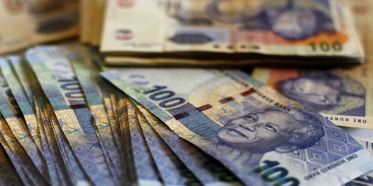 South African bank notes featuring an image of former South African President Nelson Mandela are displayed at an office in Johannesburg.