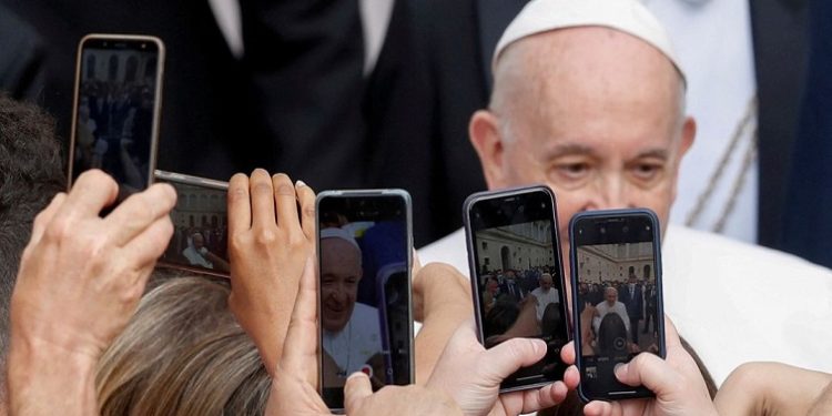 Pope Francis holds weekly general audience at the Vatican
People use their phone cameras as Pope Francis arrives for his weekly general audience, at the San Damaso courtyard at the Vatican, June 2, 2021.