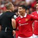 Manchester United's Cristiano Ronaldo reacts before he is shown a yellow card by referee Craig Pawson.