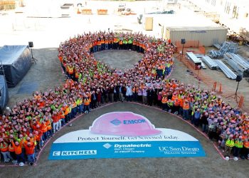 FILE PHOTO: Construction workers and hospital employees wear pink hard hats and form a giant pink ribbon to promote the start of Breast Cancer Awareness Month, at the UC San Diego Jacobs Medical Center construction site in La Jolla, California, September 30, 2014.