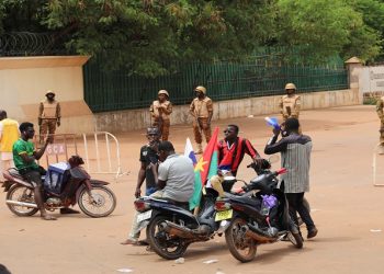 Soldiers block the road to stop the advance of protesters against junta leader Paul-Henri Damiba, on a street in Ouagadougou, Burkina Faso September 30, 2022.