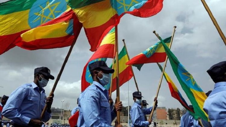 Addis Ababa police officers holding the Ethiopian national flags, in Addis Ababa, Ethiopia