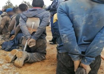 [File Image]: Illegal miners are held by police, August 2022.