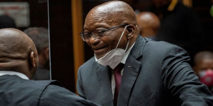 (File Image) Former South African President Jacob Zuma speaks with his legal counsel in court during his corruption trial in Pietermaritzburg, South Africa, October 26, 2021.