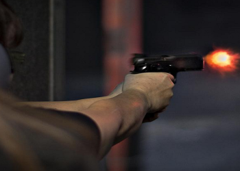 File image: A person is seen shooting a firearm