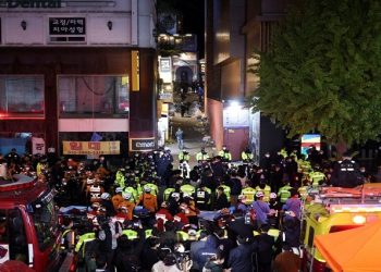 Rescue team and firefighters work at the scene where dozens of people were injured in a stampede during a Halloween festival in Seoul, South Korea, October 30, 2022.