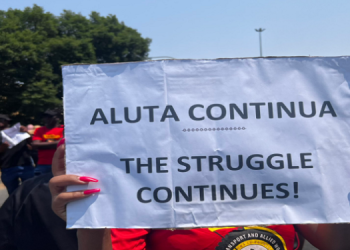 [File image] One of the Satawu members holds a placard during a strike in Johannesburg.