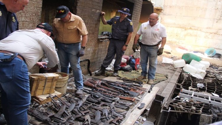 SAPS and the Hawks in the North West are seen at Stilfontein where a mine shaft was raided and various firearms were discovered on 10 October 2022.