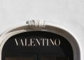 The logo of Valentino is seen in a shop in downtown Rome, Italy February 10, 2016.