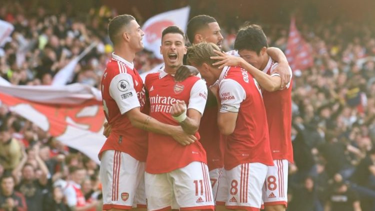 Arsenal celebrates 3-2 victory over Liverpool.