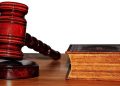 [File photo] Court gavel and book seen on a table.