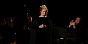 FILE PHOTO: Singer Adele is applauded as he finishes her tribute to the late George Michael at the 59th Annual Grammy Awards in Los Angeles, California, US , February 12, 2017.