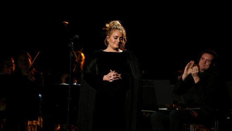 FILE PHOTO: Singer Adele is applauded as he finishes her tribute to the late George Michael at the 59th Annual Grammy Awards in Los Angeles, California, US , February 12, 2017.