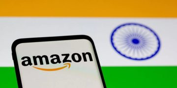 Smartphone with Amazon logo is seen in front of displayed Indian flag in this illustration taken, July 30, 2021.