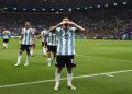 Argentina's Lionel Messi celebrates scoring their first goal.