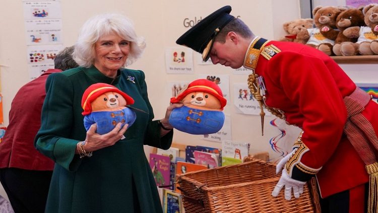 Camilla, the Queen consort, holds Paddington bears as she visits Barnardo's Nursery in Bow, London, Britain November 24, 2022.