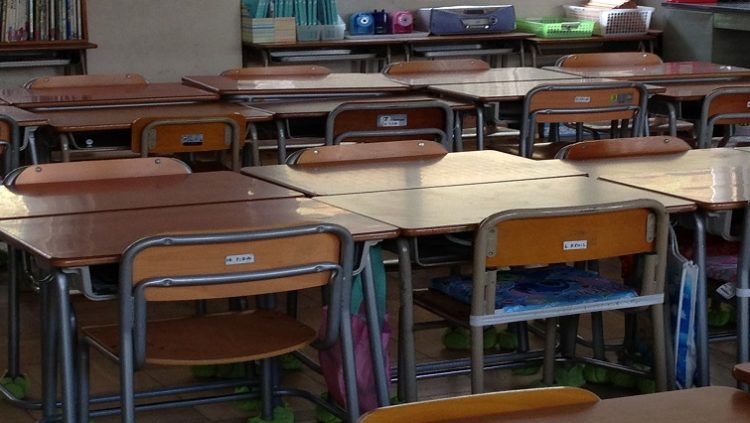 Chairs and desks in a classroom.