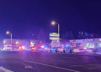 A view of various security and emergency vehicles with flashing blinkers parked on a street, after a shooting in a club, in Colarado Springs, Colorado, U.S November 20, 2022, in this picture obtained from social media. Trey Deabueno/TWITTER @TREYRUFFY/via REUTERS