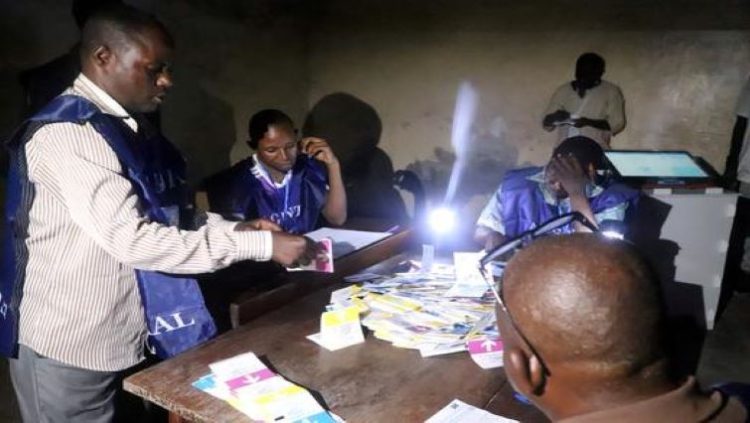 Agents of Congo's National Independent Electoral Commission (CENI) count casted ballot papers after election at a polling during the last presidential election.