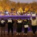 People gather for a vigil and hold white sheets of paper in protest over coronavirus disease (COVID-19) restrictions, during a commemoration of the victims of a fire in Urumqi, as outbreaks of COVID-19 continue, in Beijing, China, November 27, 2022