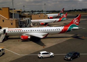 Kenya Airways planes are seen through a window as the Jomo Kenyatta international airport in Nairobi, Kenya August 1, 2020.