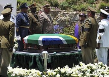 The coffin of former South African President Nelson Mandela is prepared to be buried during his funeral ceremony in Qunu, Eastern Cape, December 15, 2013