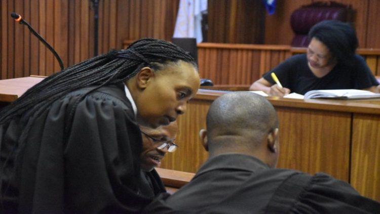Advocate Zandile Mshololo is seen consulting with legal counsel during the Senzo Meyiwa murder trial at the Nort Gauteng High Court in Pretoria on 13 September 2022.