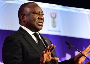 President Cyril Ramaphosa gestures during his address at the GBVF Summit in Midrand, Gauteng