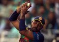 Sri Lanka's Danushka Gunathilaka takes a catch to dismiss Pakistan's Mohammad Rizwan.