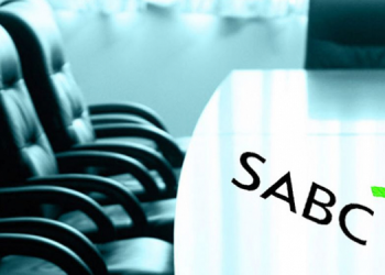 A Boardroom with the SABC logo.