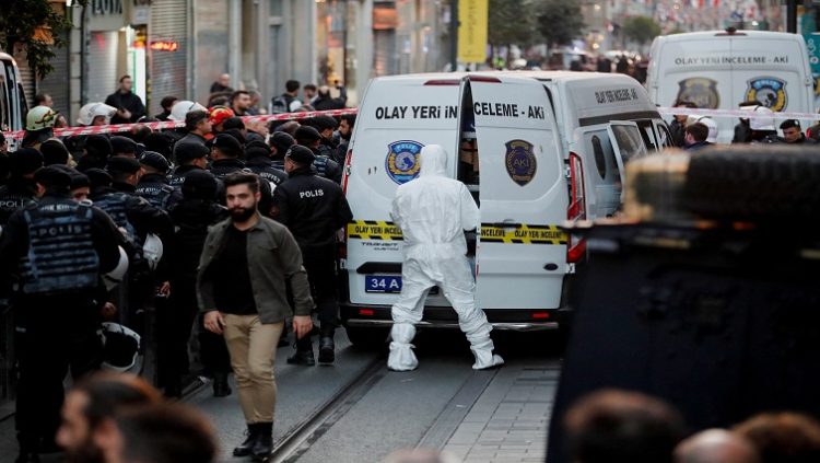 A forensic technician works after an explosion on busy pedestrian Istiklal street in Istanbul, Turkey, November 13, 2022.