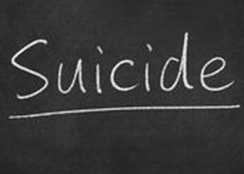 The word suicide written on a board.