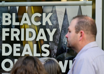 A general view of a sign highlighting discounted items as Black Friday sales begin at The Outlet Shoppes of the Bluegrass in Simpsonville, Kentucky, U.S., November 26, 2021.