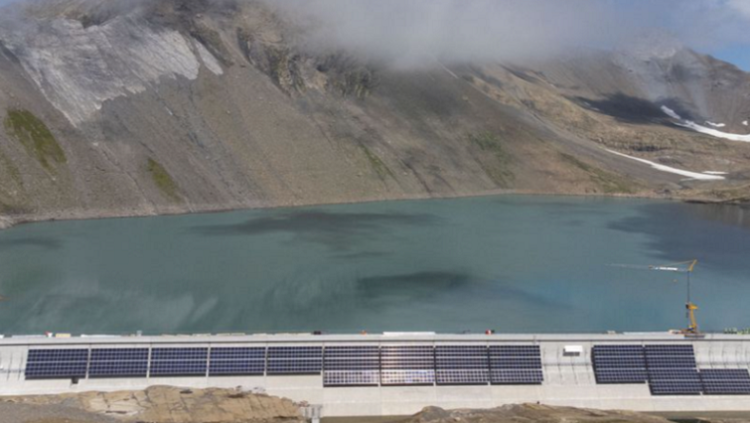 [FILE IMAGE] Solar panels are seen on the construction site of a large-scale photovoltaic system of Swiss energy provider Axpo at some 2500 metres above sea level on the dam of Lake Muttsee, Switzerland August 19, 2021.