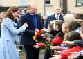 Prince William and his wife Kate interacting with a crowd in the UK
