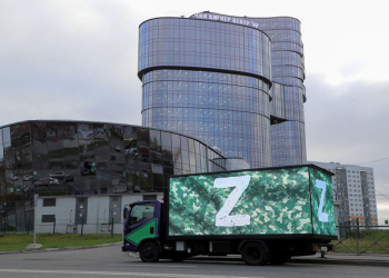A truck displaying the symbols "Z" in support of the Russian armed forces involved in a military conflict in Ukraine is parked outside PMC Wagner Centre, which is a project implemented by the businessman and founder of the Wagner private military group Yevgeny Prigozhin, during the official opening of the office block in Saint Petersburg, Russia, November 4, 2022
