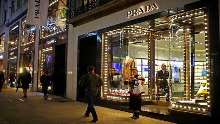 Festive lights decorate the Prada store on New Bond Street as shoppers do Christmas shopping in central London, Britain, December 16, 2018. REUTERS/Henry Nicholls