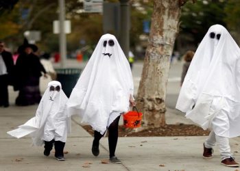 [File Image]:People with costumes walk during Halloween in Sierra Madre, California, U.S., October 31, 2017.