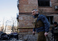 Kyiv Mayor Vitali Klitschko serves at the place where a shell hit a residential building, as Russia's invasion of Ukraine continues, in Kyiv, Ukraine March 18, 2022.