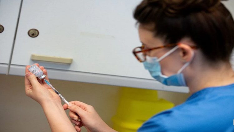 A nurse prepares a dose of the Moderna coronavirus disease (COVID-19) vaccine at the Glangwili General Hospital in Carmarthen, Wales, Britain.