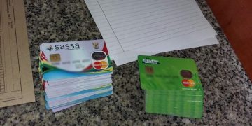Sassa and EasyPay cards and documents on a table.