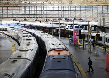 A view of trains on the platform at Waterloo Station as a station worker stands nearby, on the first day of national rail strike in London, Britain, June 21, 2022. REUTERS/Henry Nicholls