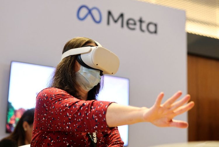 A person uses virtual reality headset at Meta stand during the ninth Summit of the Americas in Los Angeles, California, US, June 8, 2022.