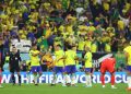Brazil's Casemiro and Lucas Paqueta celebrate after the match as Brazil progress to the quarter finals.