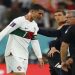 Portugal's Cristiano Ronaldo and coach Fernando Santos look dejected after the match as Portugal are eliminated from the World Cup.