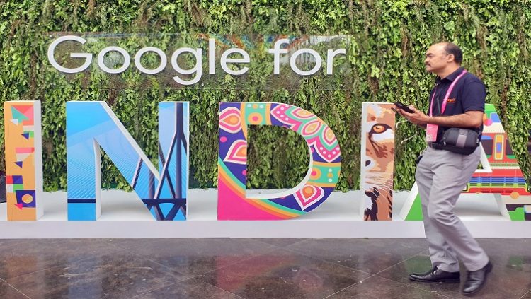 A man walks past the sign of "Google for India", the company's annual technology event in New Delhi, India, September 19, 2019.