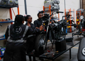 Workers at ARC Ride assemble an electric motorcycle at the company's warehouse in Industrial Area, Nairobi, Kenya November 2, 2022.
