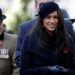Prince Harry's wife Meghan smiles while arriving for an event